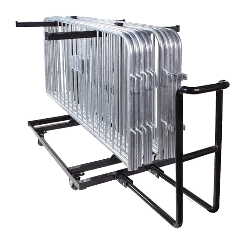 Wheeled storage cart with galvanized barricades stacked upright against its frame.
