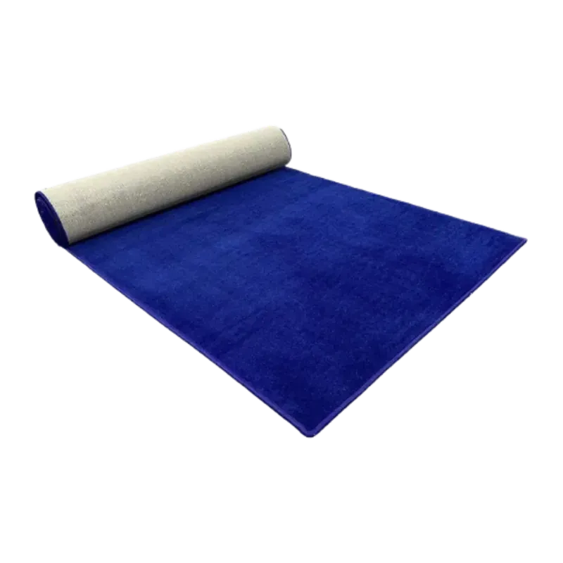 Navy blue carpet runner opened out on a slight angle, the rest still on a roll that shows the grey backing.