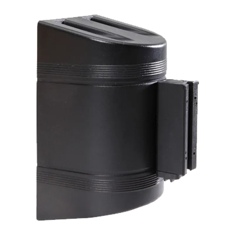 Black wall mounted belt cassette with the belt drawn part way out and its end clip hanging free.